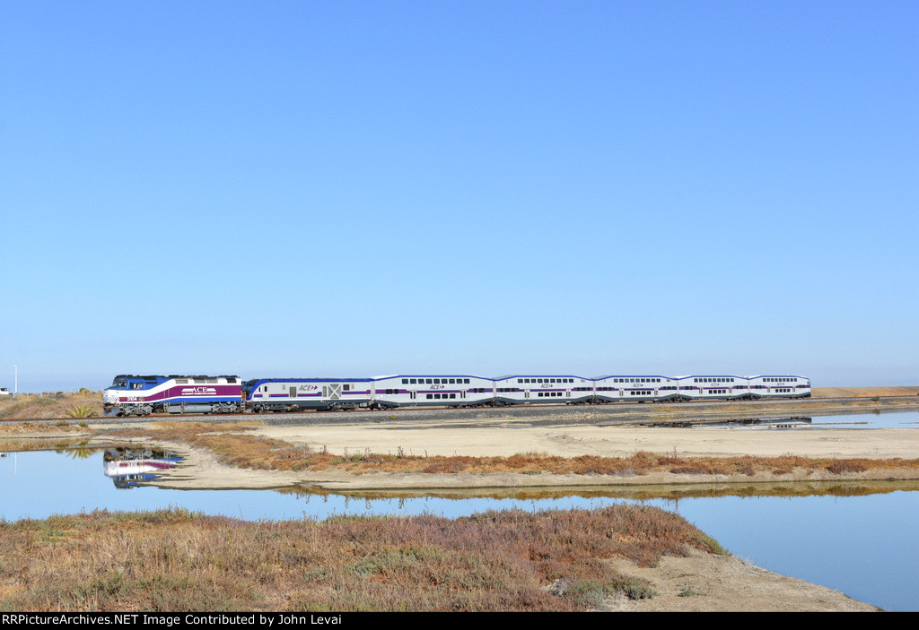 San Jose Diridon bound ACE Train # 07 finishes clearing the long causeway over the bad just before entering the Alviso Section of San Jose and crossing Elizabeth St at grade. A very interesting lashup of power is leading-an F40PH-3C with a SC-44 unit. 